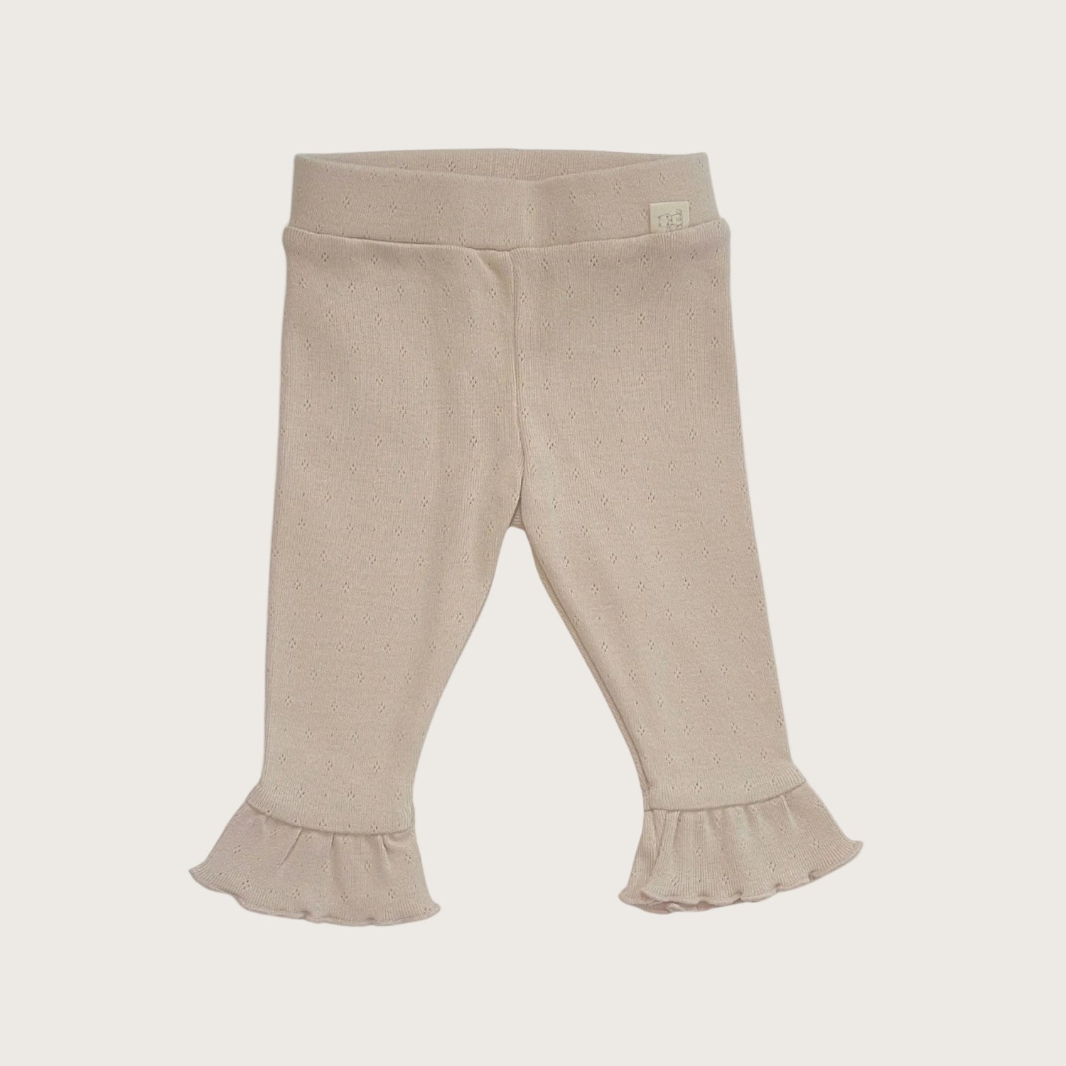 Baby legging van beige pointelle katoen met geruffelde onderkant 