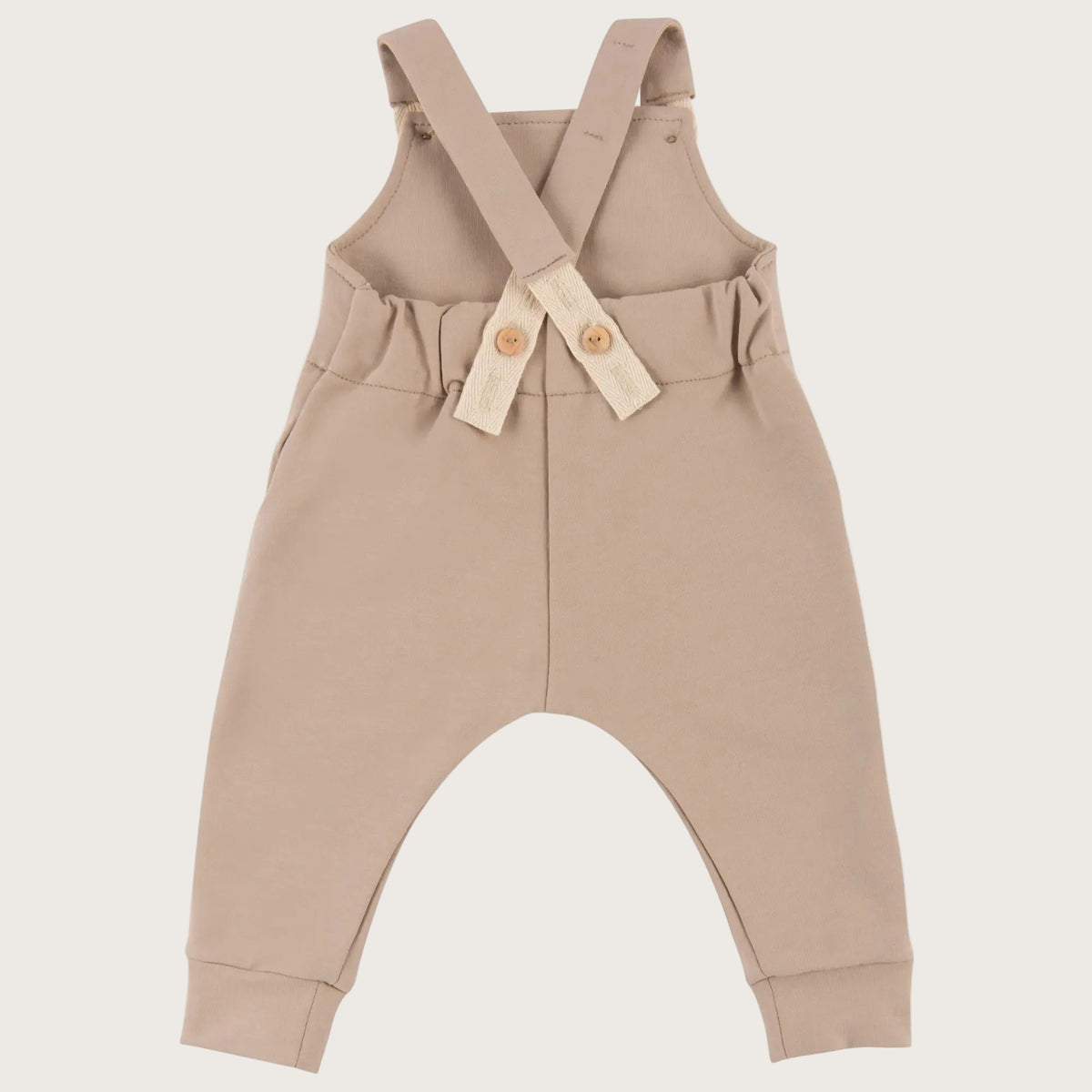 Baby tuinbroek/ salopette in zandkleur - achterkant
