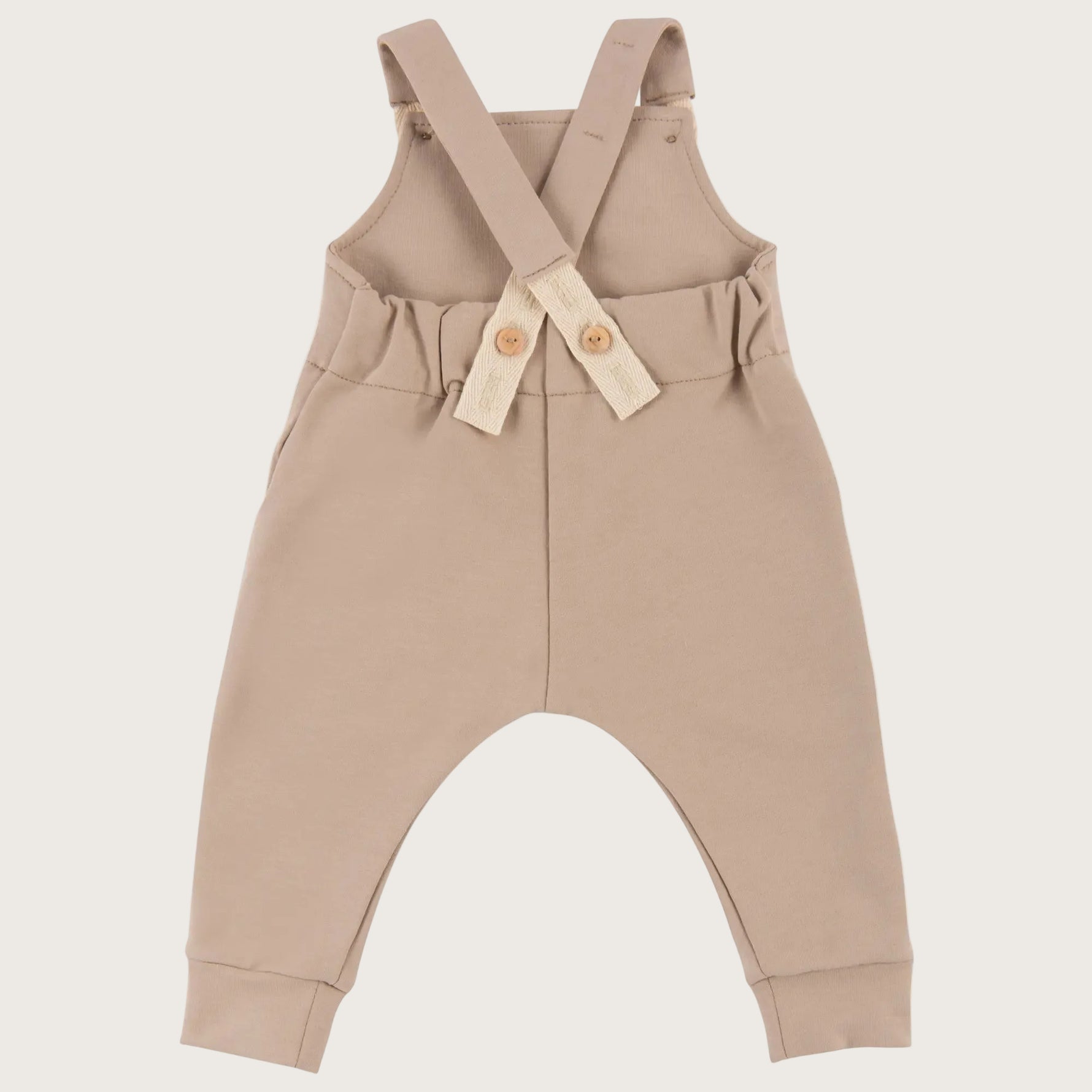 Baby tuinbroek/ salopette in zandkleur - achterkant