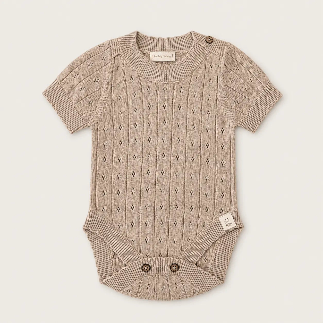 Beige pointelle gebreide romper van katoen 