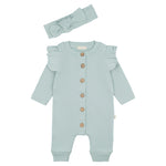 turquoise baby boxpakje met houten knoopjes en bijpassende haarband, platgelegd