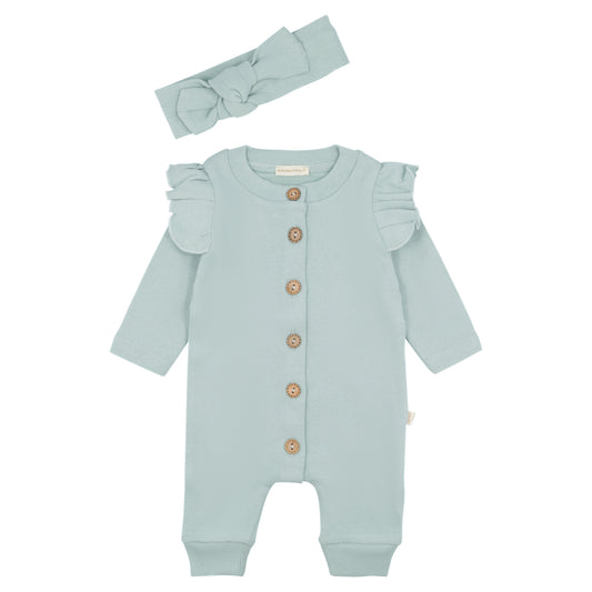 turquoise baby boxpakje met houten knoopjes en bijpassende haarband, platgelegd