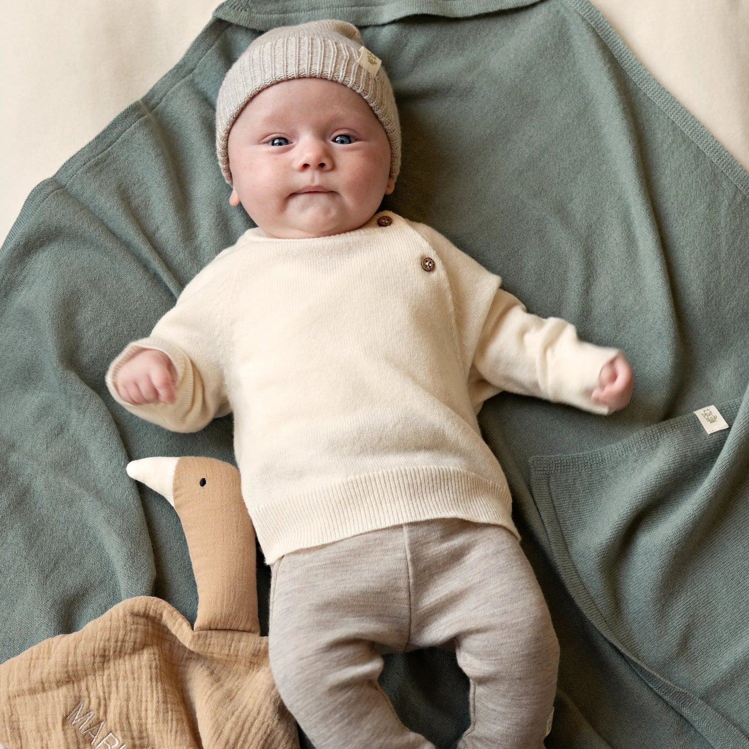 Creme kleurige wollen babytrui