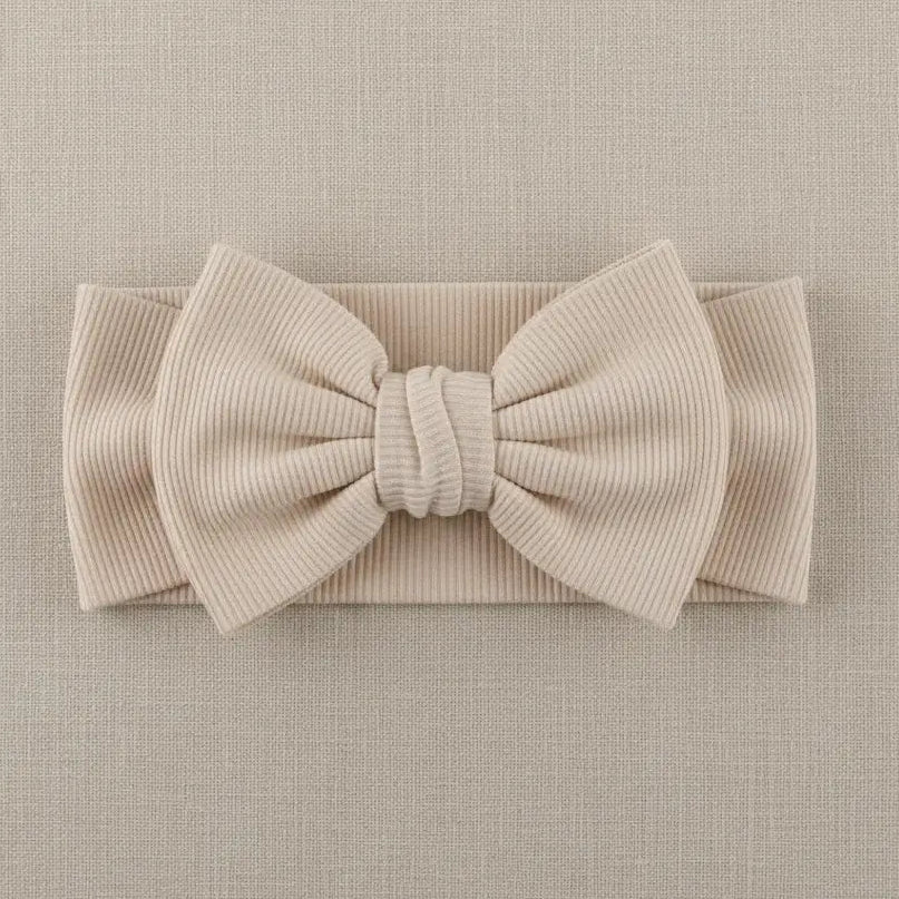 Licht beige baby haarband met grote strik