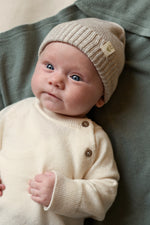 baby in Merinowool and cashmere baby sweater cream