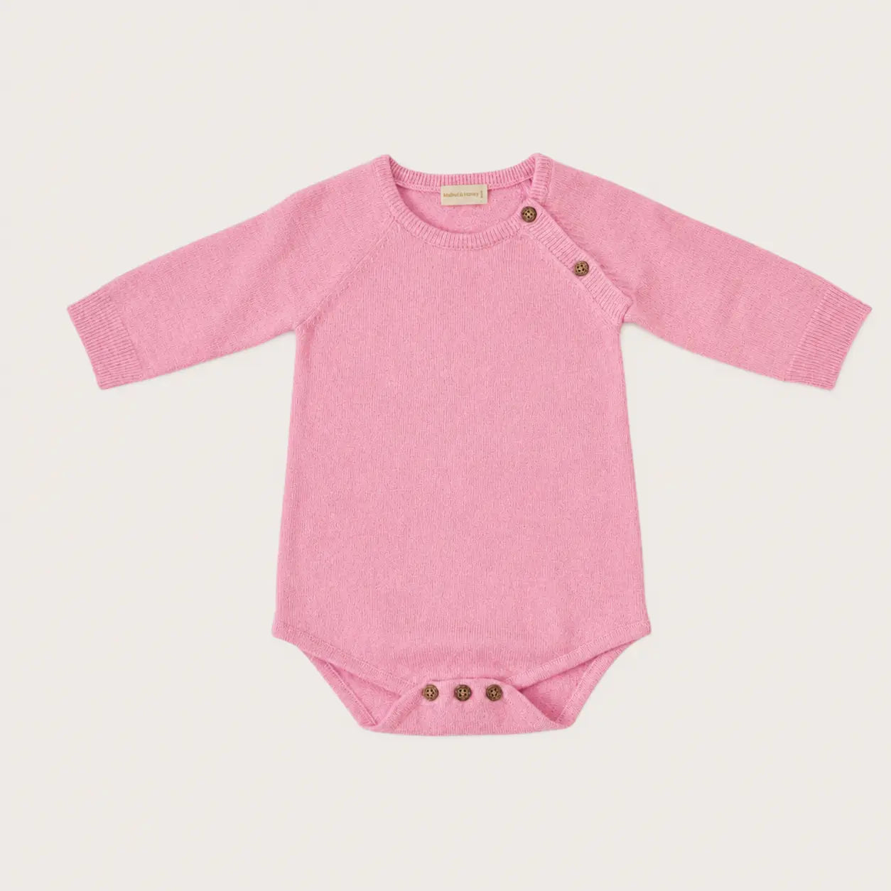 Roze gebreide romper van merinowol en cashmere 
