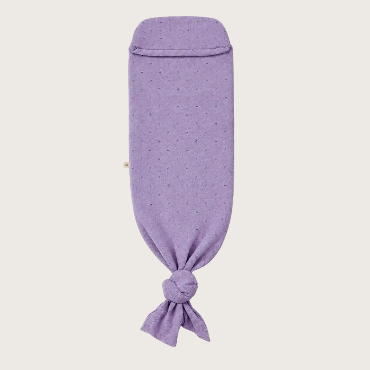 Pointelle Snuggle Coco Lavender: lavender merino wool baby cocoon in pointelle knit, with a knot