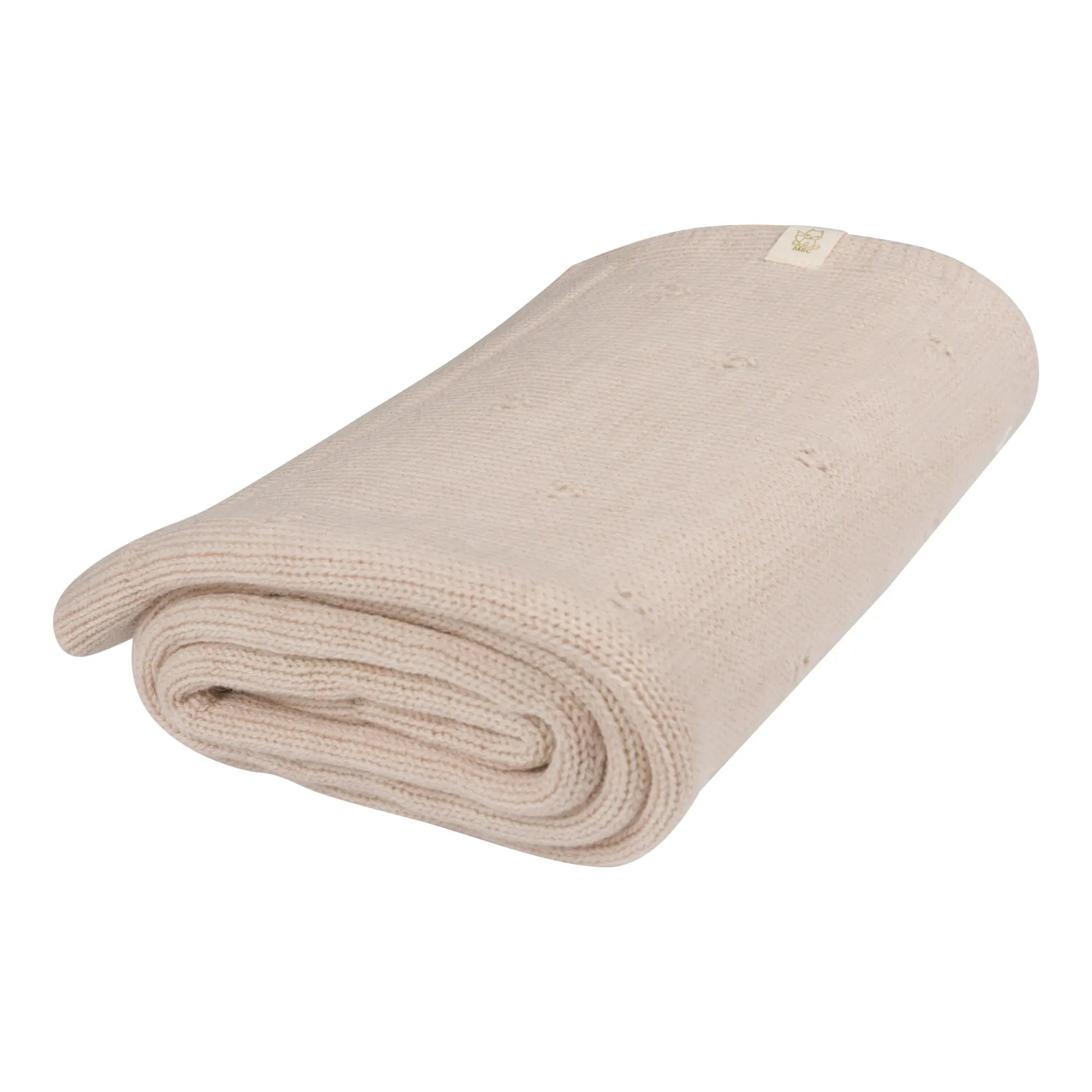 beige wollen deken opgevouwen 