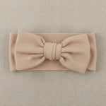 beige haarband met grote strik voor baby's 