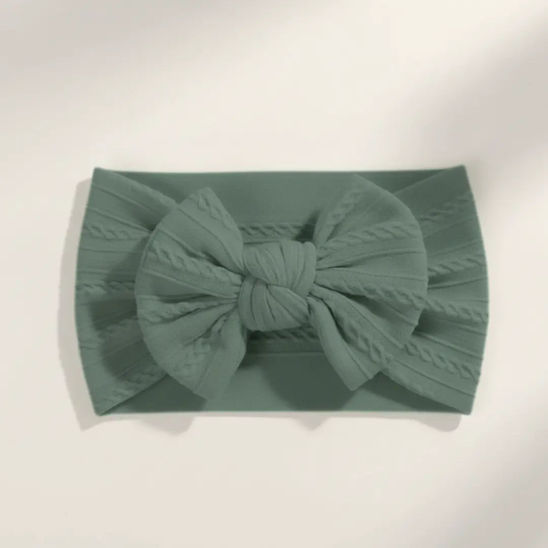 Sage groen kleurige elastische baby haarband met strik