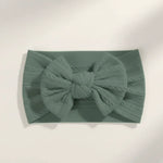 Sage groen kleurige elastische baby haarband met strik