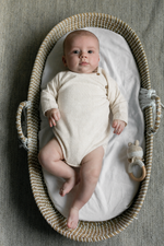 Baby in rotan basket in merinowool and cashmere body 