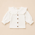 off white katoenen baby bloesje met geruffelde kraag 